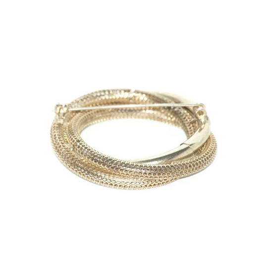 Broche dorado circular